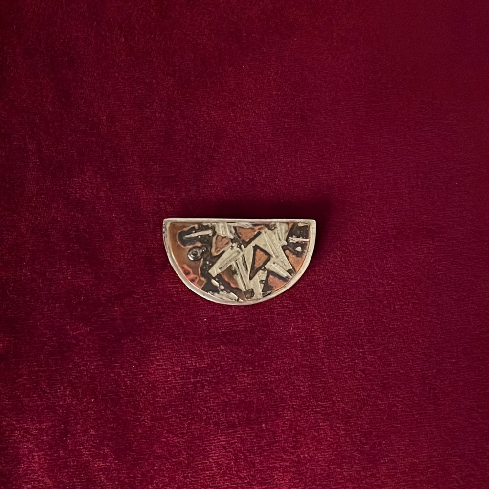 2/15 Vintage pin, I think it shows an archeological dig